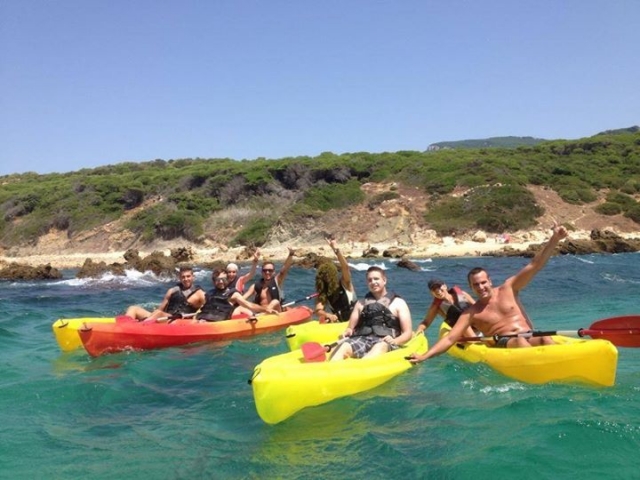  Group of boys and girls in kayaks 